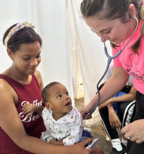 MCC Global Health Club student provides care during medical mission.